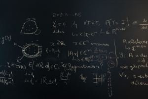Image of a blackboard with equations written on it