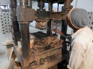 Image of Eco-blac bricks being made. Image: Tata Center