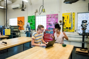 Two students work in a makerspace