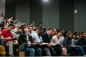 Students in a lecture hall during a class about machine learning.
