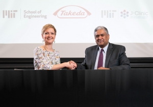 Anantha Chandrakasan, dean of MIT's School of Engineering (right), and Anne Heatherington, senior vice president and head of Data Sciences Institute at Takeda, at the ceremonial signing for the establishment of the MIT-Takeda Program ​ Photo: David Degner