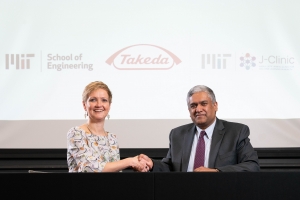 Anantha Chandrakasan, dean of MIT's School of Engineering (right), and Anne Heatherington, senior vice president and head of Data Sciences Institute at Takeda, at the ceremonial signing for the establishment of the MIT-Takeda Program. Photo: David Degner