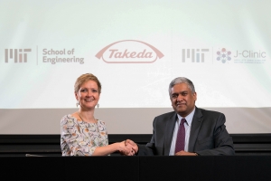 Anantha Chandrakasan, dean of MIT's School of Engineering (right), and Anne Heatherington, senior vice president and head of Data Sciences Institute at Takeda, at the ceremonial signing for the establishment of the MIT-Takeda Program ​ Photo: David Degner